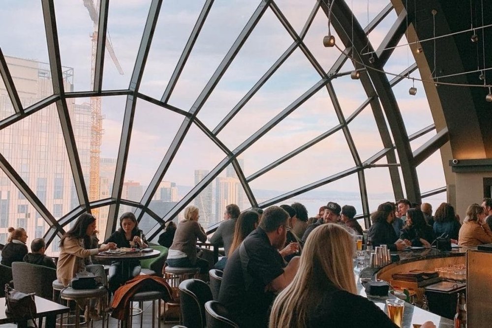 a group of people sitting at a table