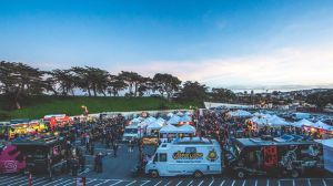 a group of people riding on the back of a truck