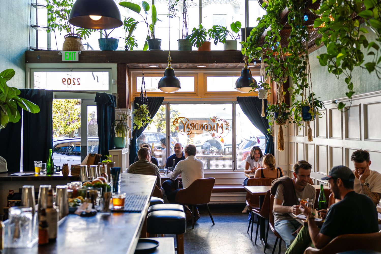 a group of people sitting at a table in a restaurant