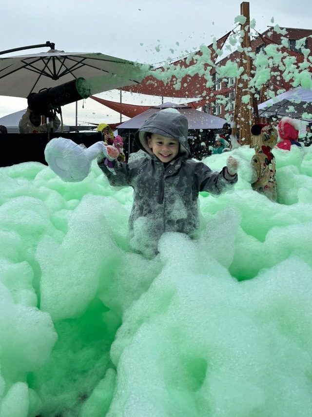 a group of people that are standing in foam