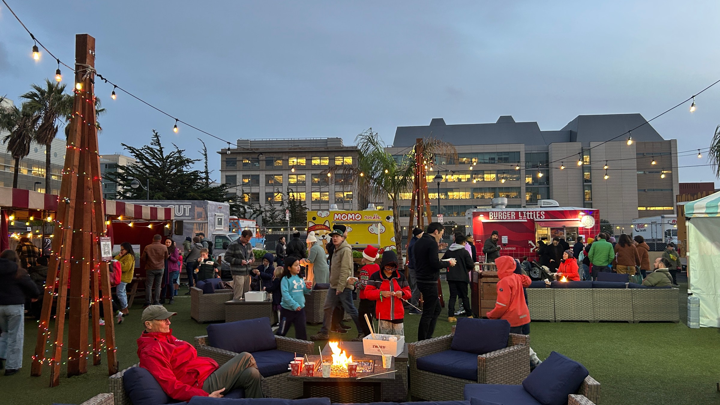 a group of people sitting in front of a building