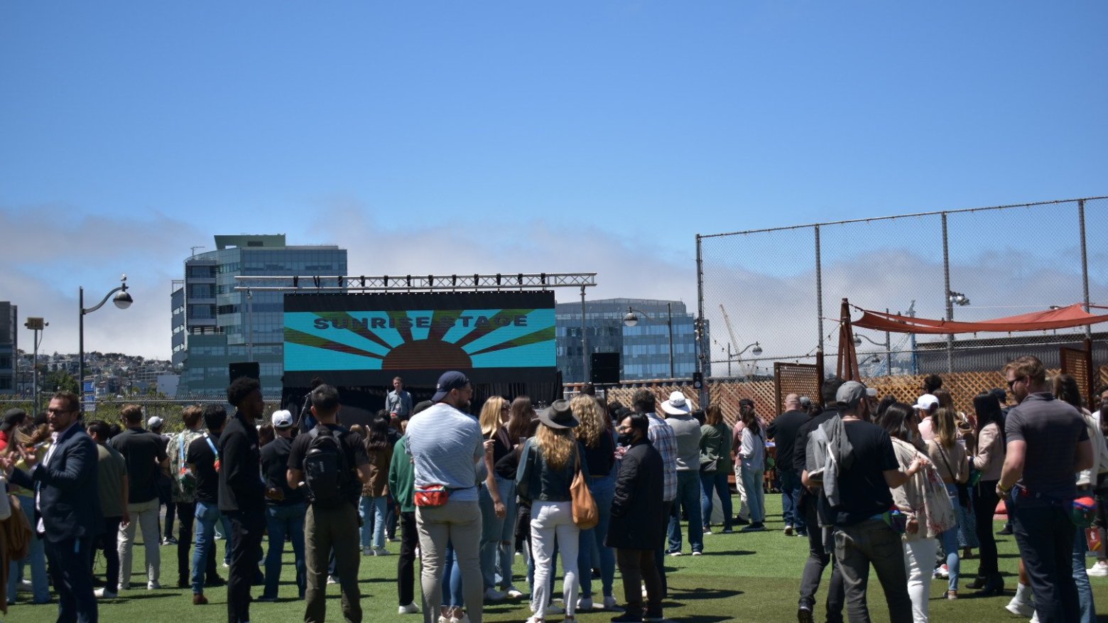 a group of people standing in front of a crowd