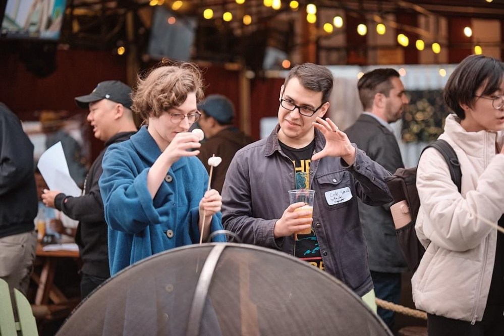 a group of people standing in front of a crowd