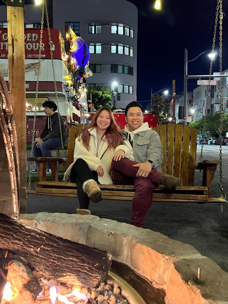 a man and a woman sitting on a bench