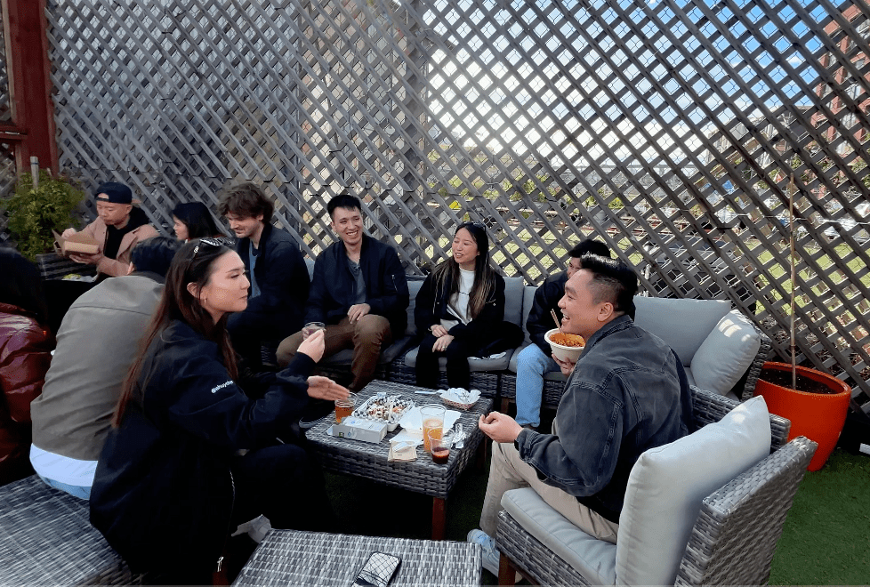 a group of people sitting at a table