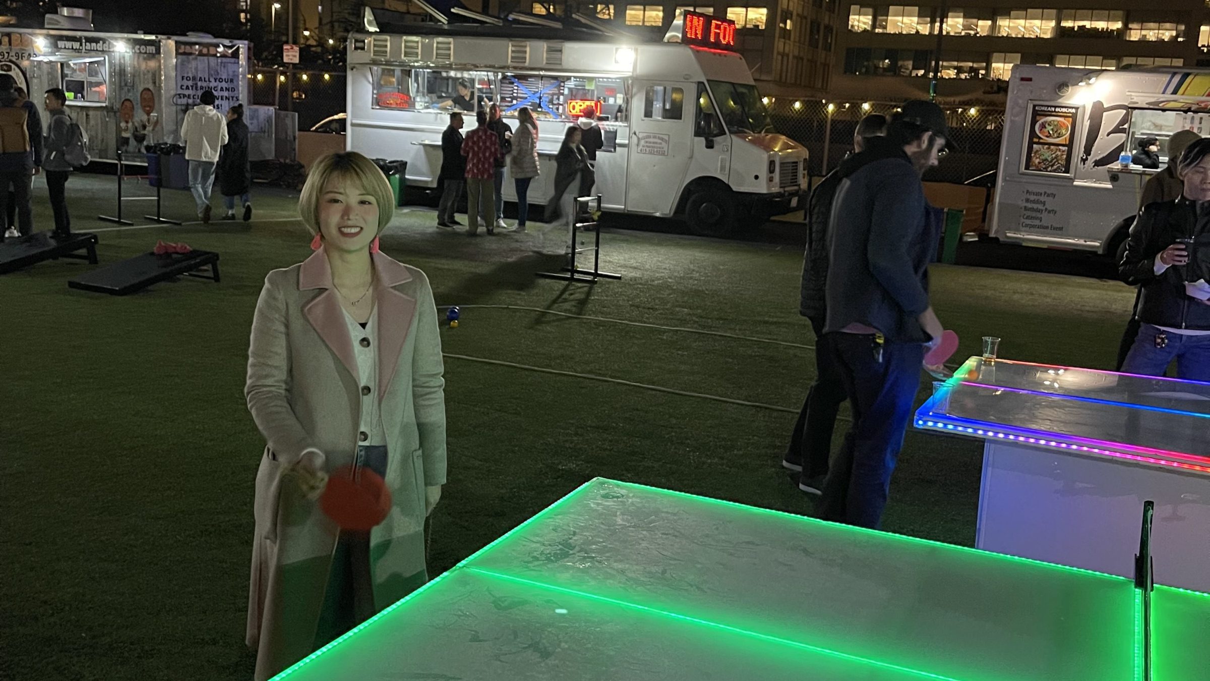 a group of people standing around a table
