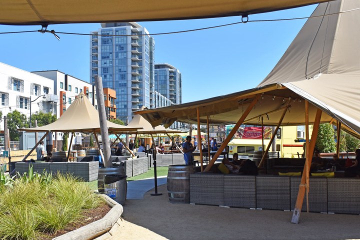 a group of people sitting at a bus stop