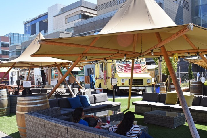 a group of people sitting at a dock