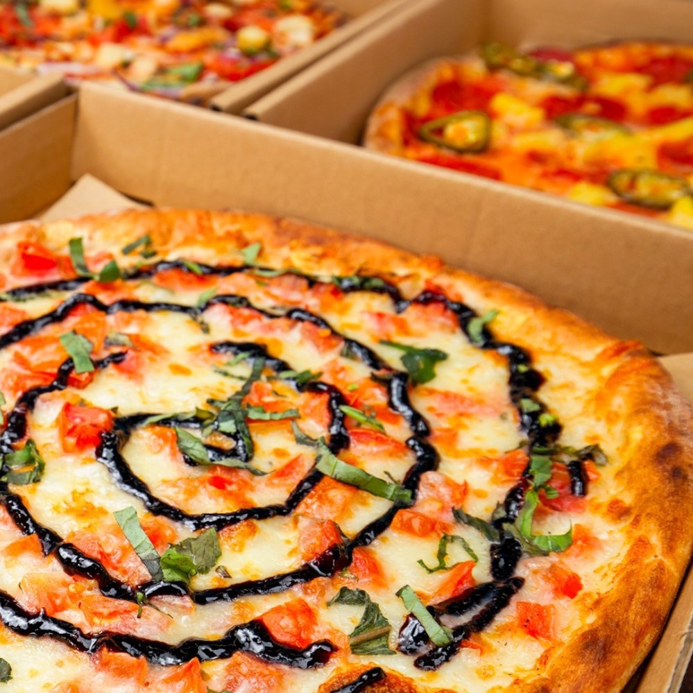 a close up of a box of pizza